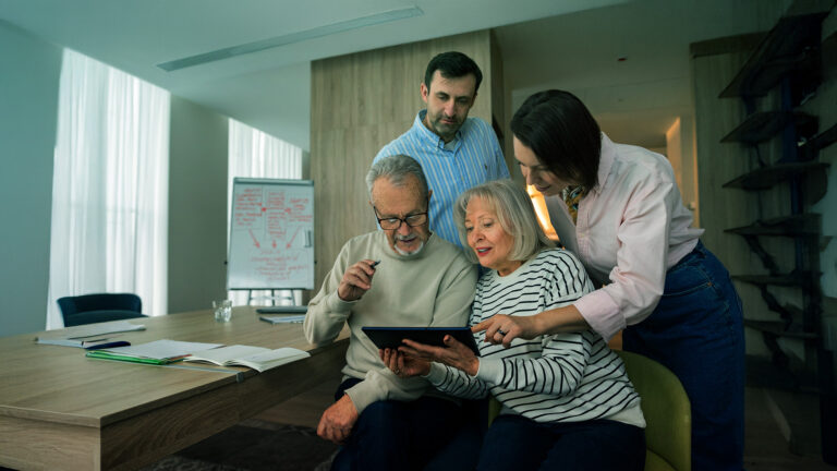 Daughter teaching her parents how to make appointments through LTS App