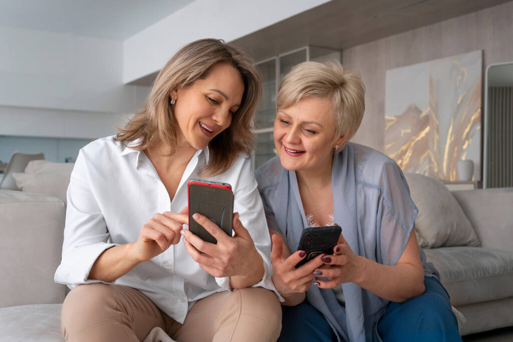 Daughter teaching her mother how to use the LTS app