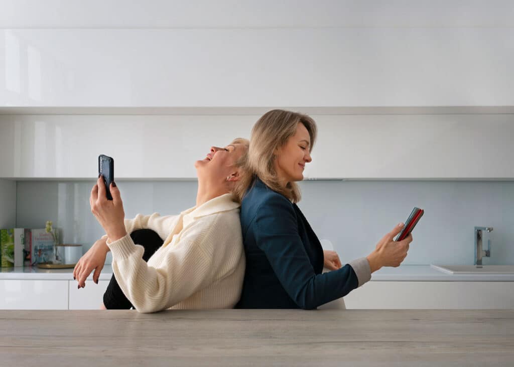 Mother and daughter using the cellphone