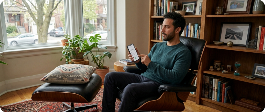Man sitting in living room, Rogers customer dialing the local numbers to successfully speak to Rogers Mobility agent and fix an account error